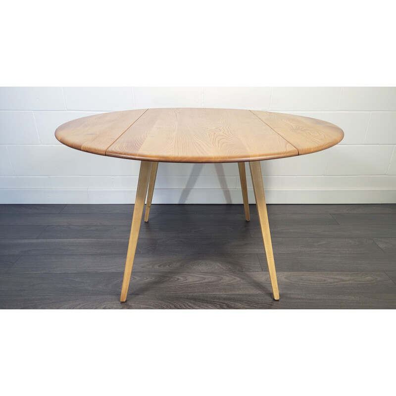 Vintage round drop leaf dining table by Ercol, 1960s