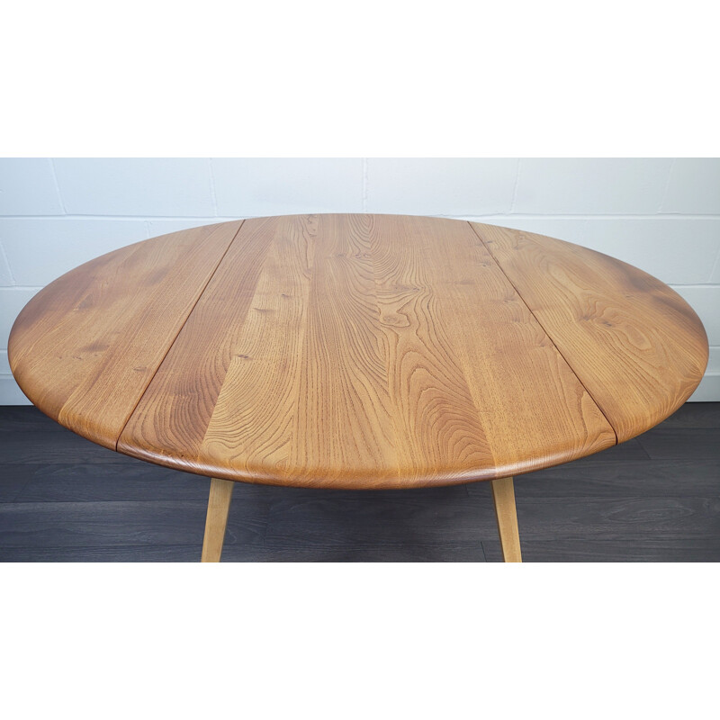 Vintage round drop leaf dining table by Ercol, 1960s