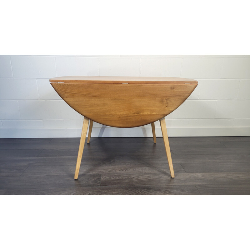 Vintage round drop leaf dining table by Ercol, 1960s