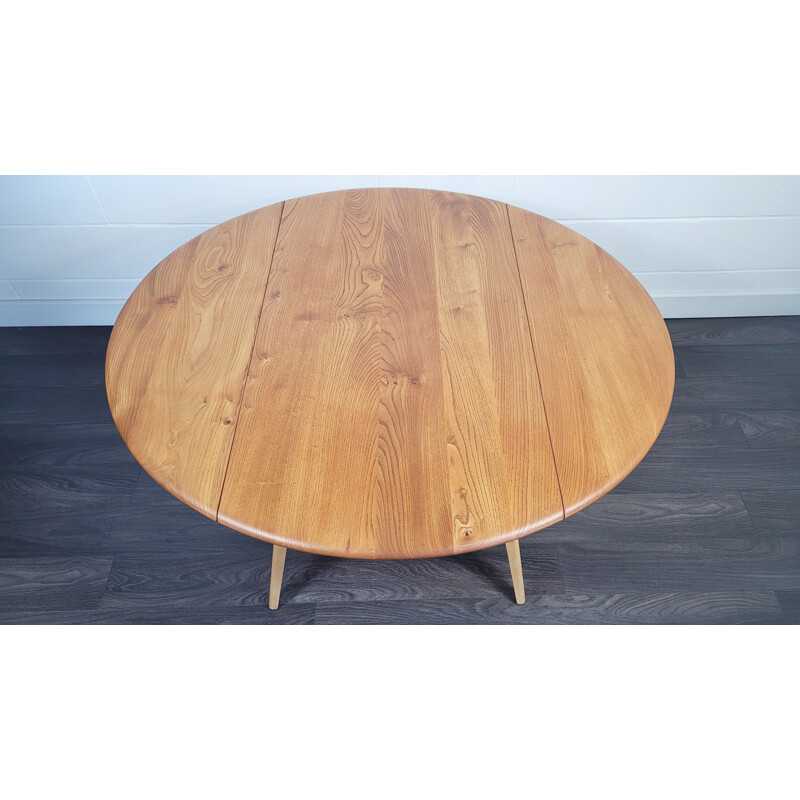 Vintage round drop leaf dining table by Ercol, 1960s