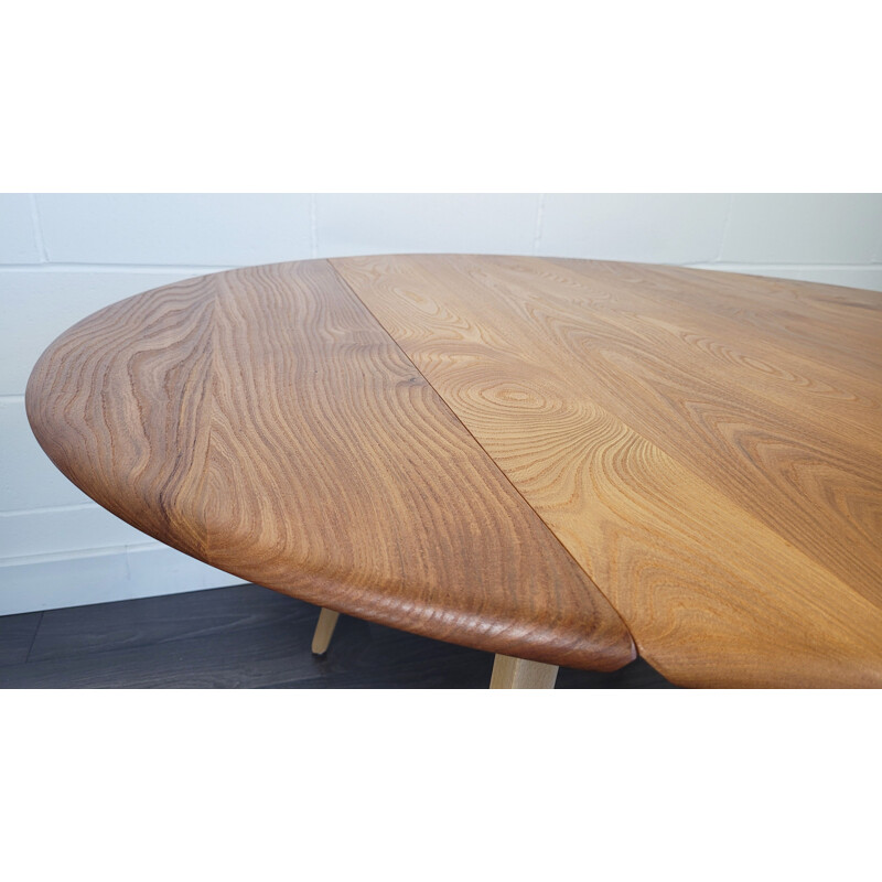 Vintage round elmwood and beechwood drop leaf dining table by Ercol, 1960s