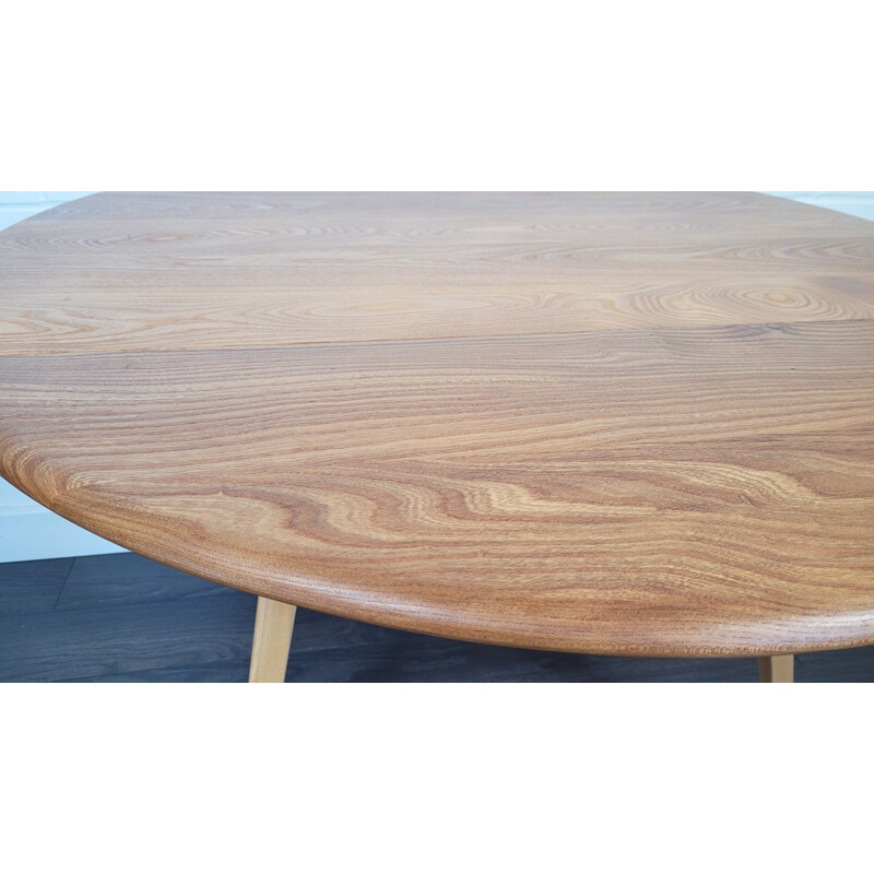Vintage round elmwood and beechwood drop leaf dining table by Ercol, 1960s