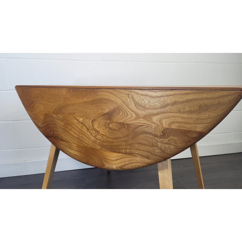 Vintage round elmwood and beechwood drop leaf dining table by Ercol, 1960s