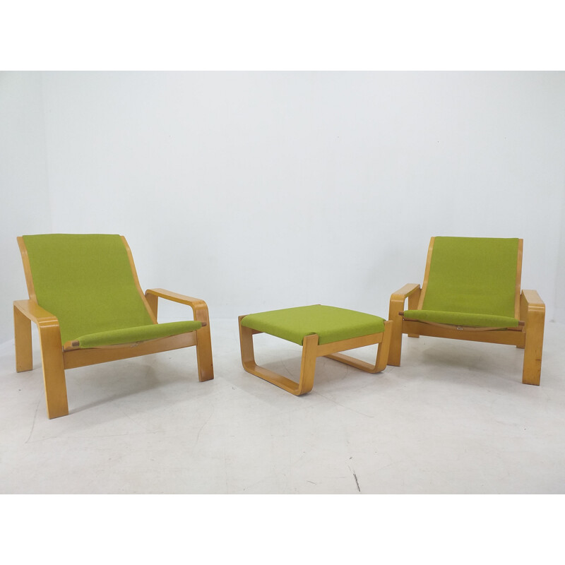 Pair of vintage armchairs and footrests "Pulkka" by Ilmari Lappalainen for Asko, Finland 1970