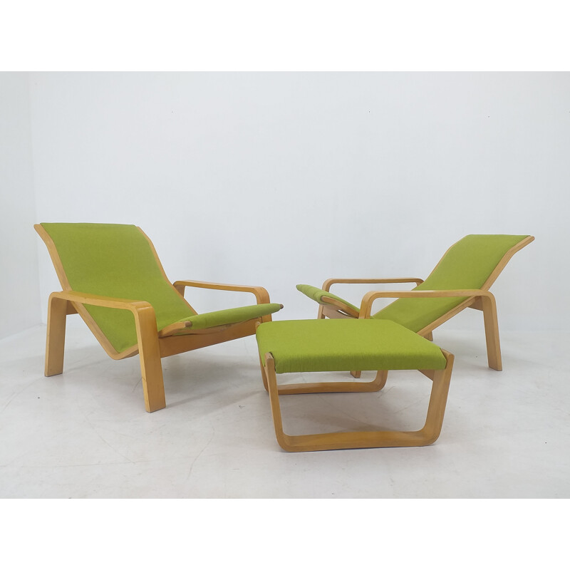 Pair of vintage armchairs and footrests "Pulkka" by Ilmari Lappalainen for Asko, Finland 1970