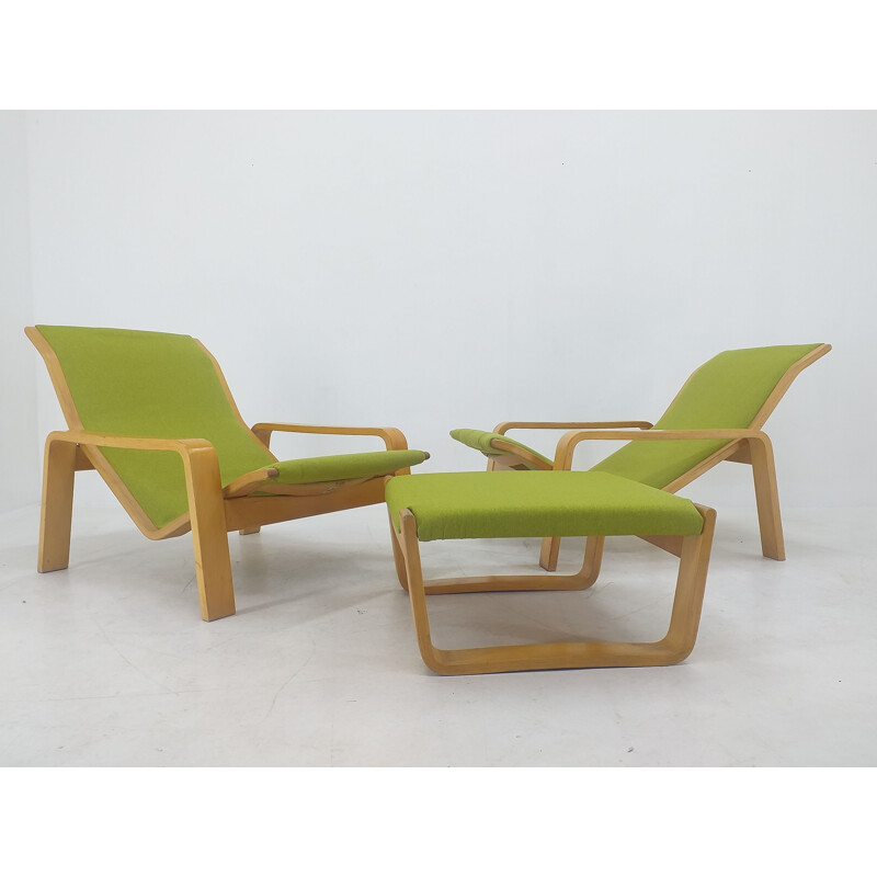 Pair of vintage armchairs and footrests "Pulkka" by Ilmari Lappalainen for Asko, Finland 1970