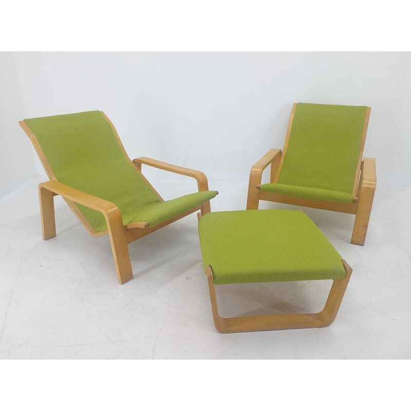 Pair of vintage armchairs and footrests "Pulkka" by Ilmari Lappalainen for Asko, Finland 1970