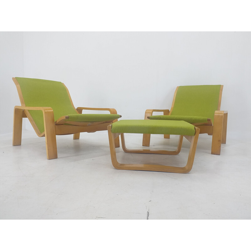 Pair of vintage armchairs and footrests "Pulkka" by Ilmari Lappalainen for Asko, Finland 1970