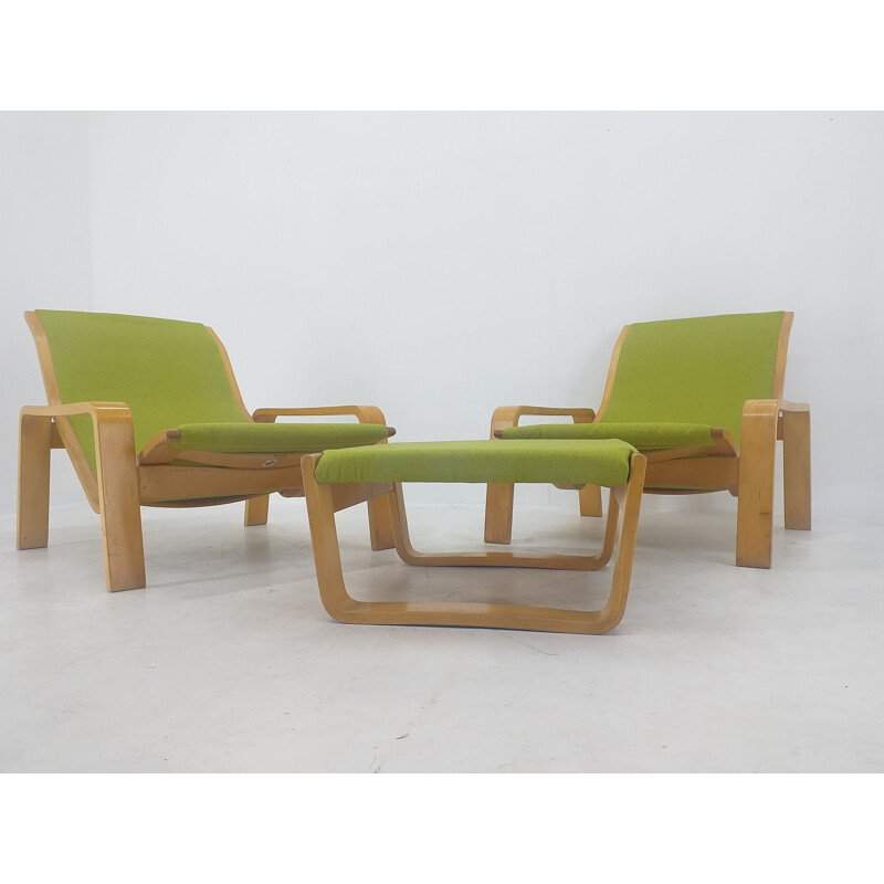 Pair of vintage armchairs and footrests "Pulkka" by Ilmari Lappalainen for Asko, Finland 1970