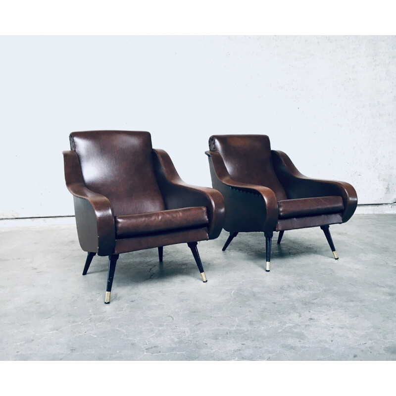 Pair of mid century brown leather armchairs, 1950s