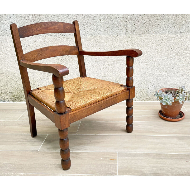 Vintage solid oakwood and straw armchair