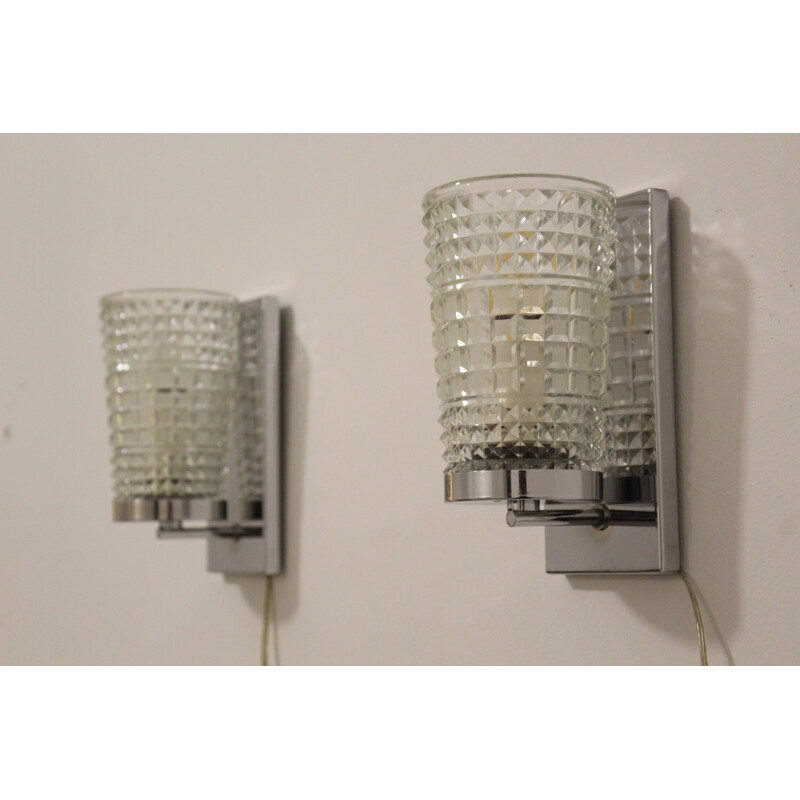 Pair of vintage wall lamps made of worked glass and chromium-plated metal , Italy 1970s