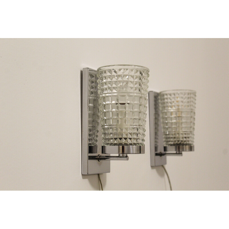 Pair of vintage wall lamps made of worked glass and chromium-plated metal , Italy 1970s