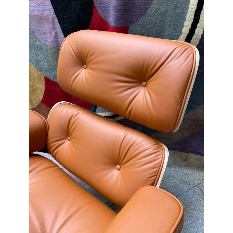 Vintage armchair and ottoman in cognac leather and rosewood by Charles Eames for Herman Miller, 2011