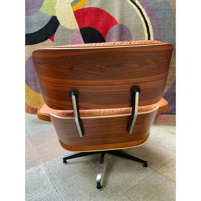 Vintage armchair and ottoman in cognac leather and rosewood by Charles Eames for Herman Miller, 2011