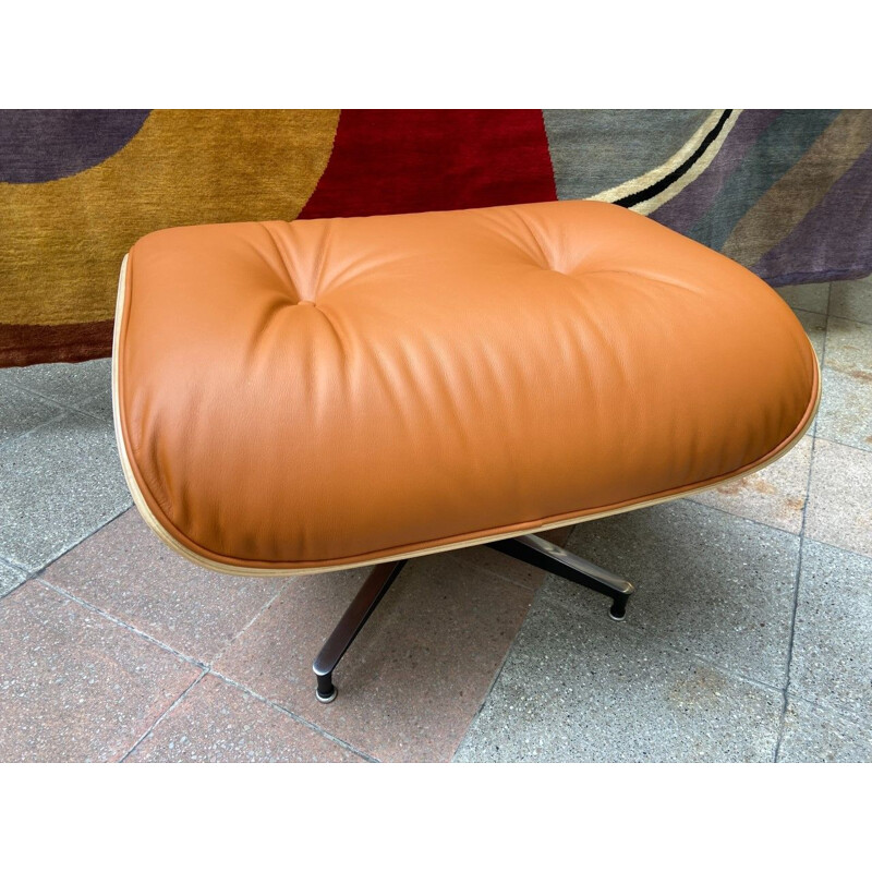 Vintage armchair and ottoman in cognac leather and rosewood by Charles Eames for Herman Miller, 2011