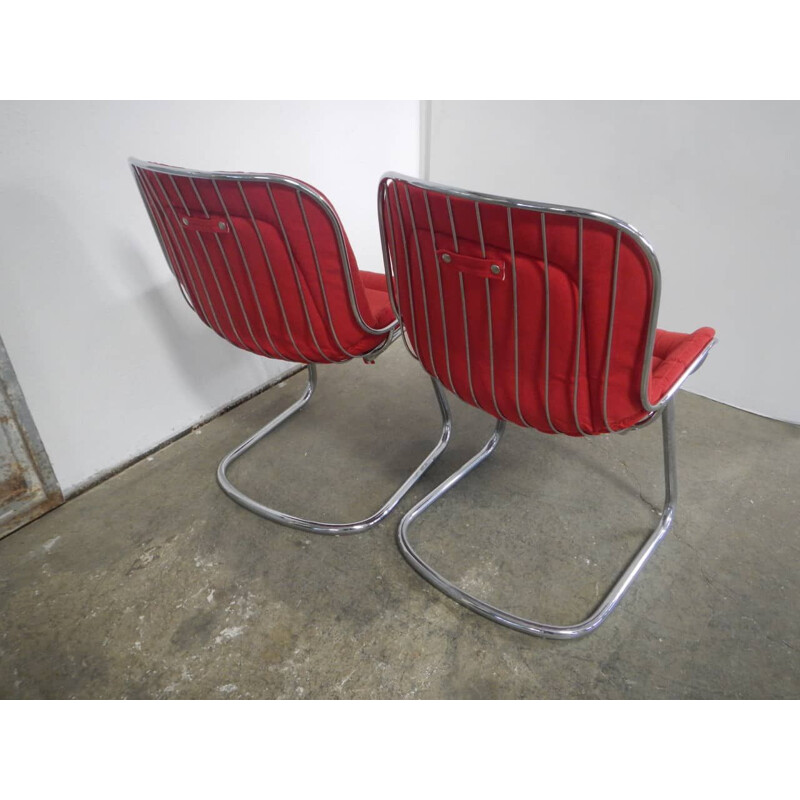 Pair of vintage rima armchairs in chromed metal and red fabric, Italy