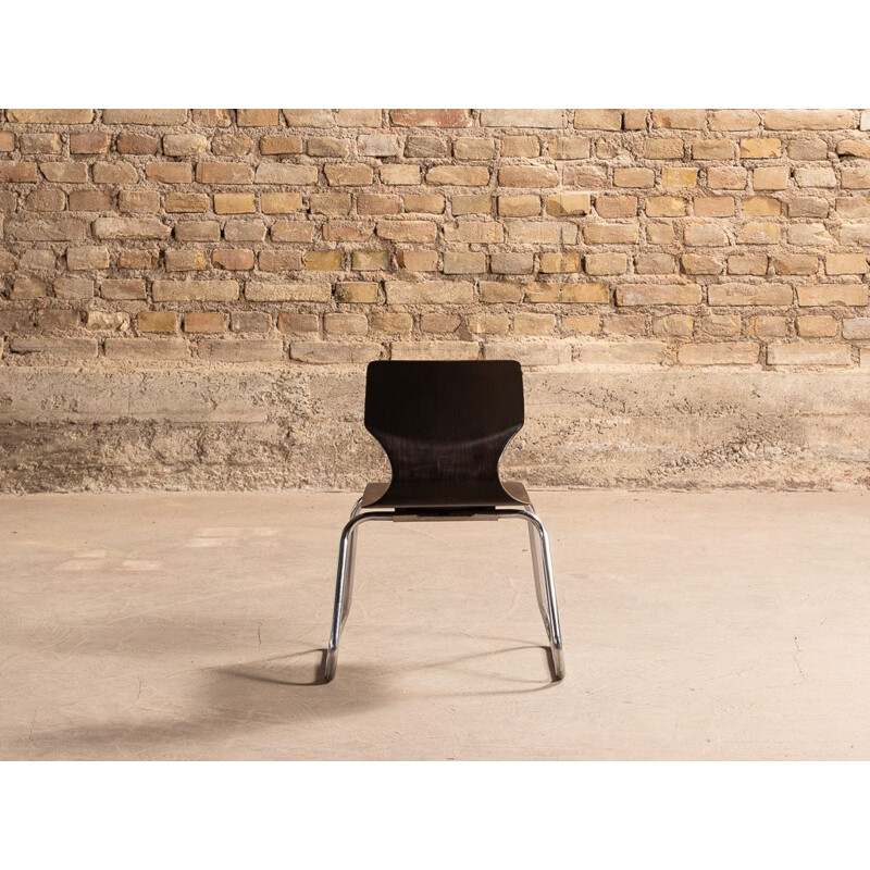 Vintage children's chair with chromed metal legs