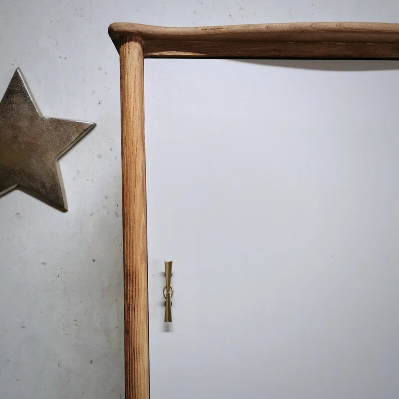 Narrow vintage cabinet with compass legs