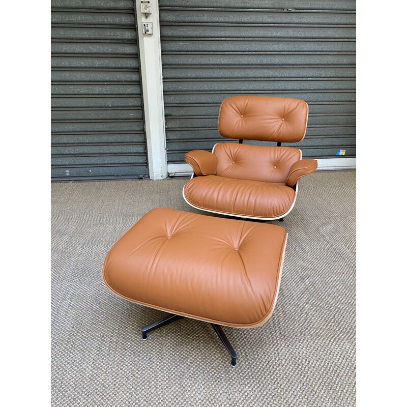 Vintage lounge chair and ottoman in cognac leather by Charles Eames for Herman Miller, USA 2011