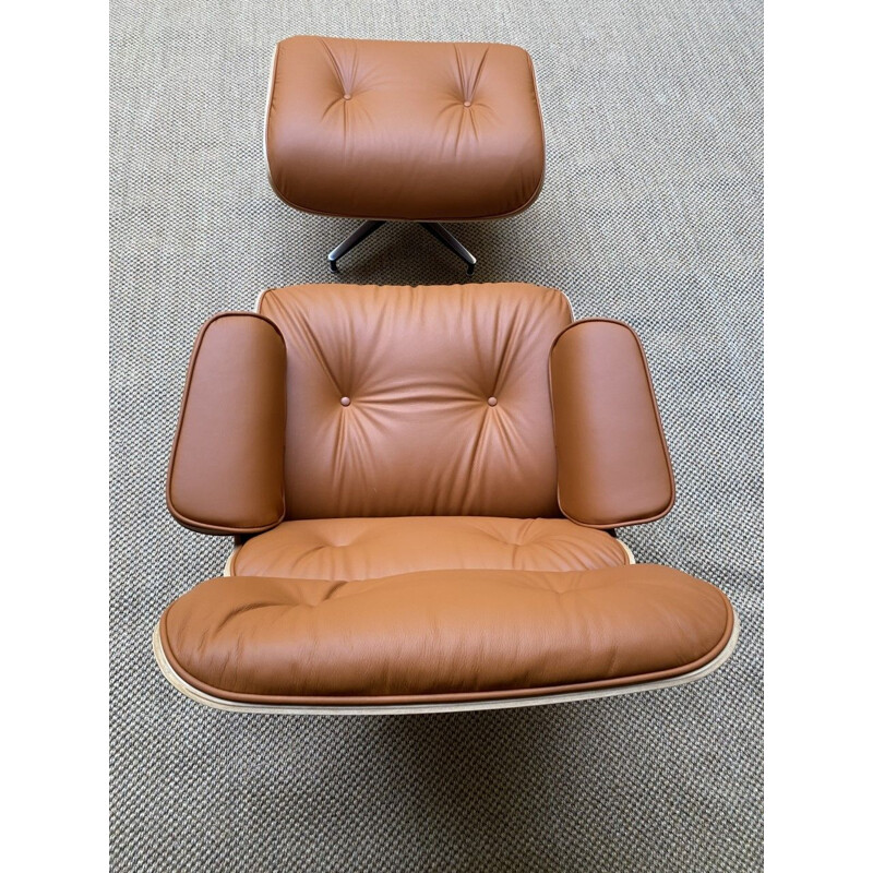 Vintage lounge chair and ottoman in cognac leather by Charles Eames for Herman Miller, USA 2011