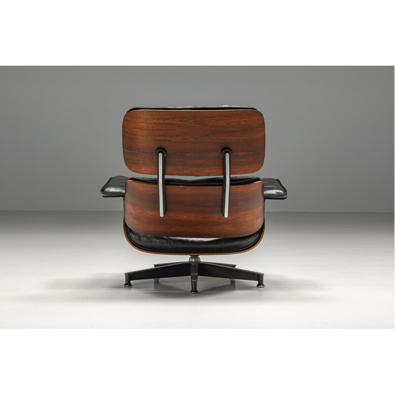 Vintage leather and rosewood armchair with ottoman by Eames for Herman Miller, 1957