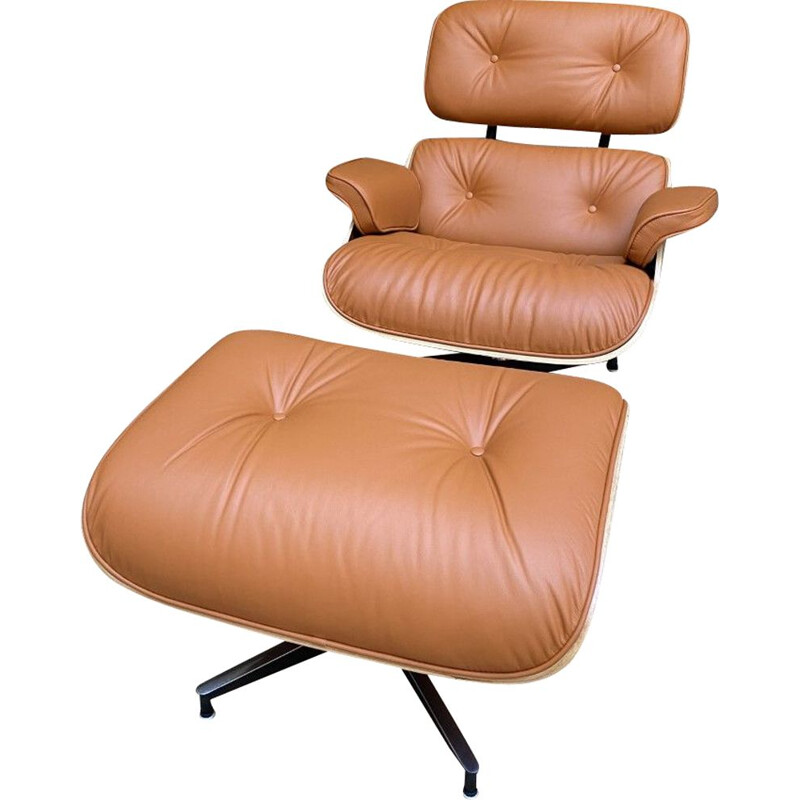 Vintage lounge chair and ottoman in cognac leather by Charles Eames for Herman Miller, USA 2011