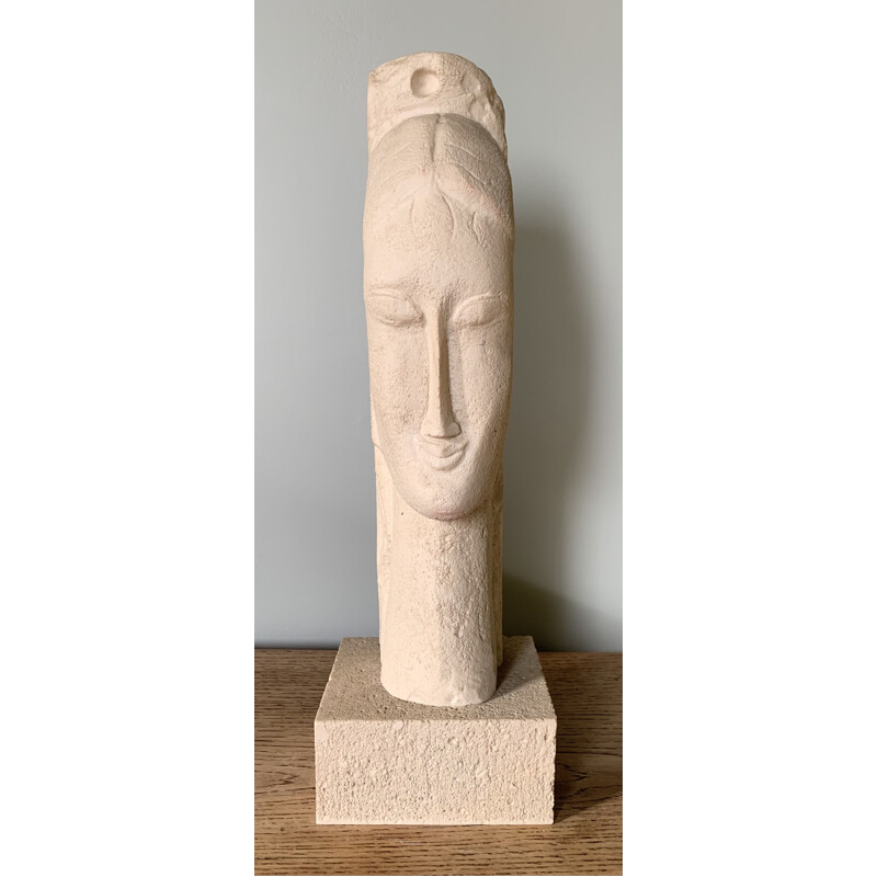 Vintage sculpture of a woman's head in stone and resin