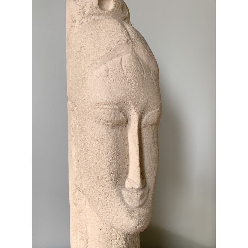 Vintage sculpture of a woman's head in stone and resin