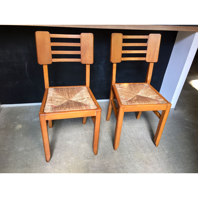 Pair of vintage wood and straw chairs by Pierre Cruège