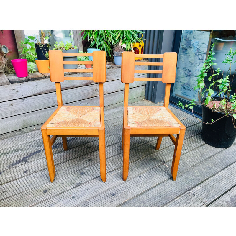 Pair of vintage wood and straw chairs by Pierre Cruège