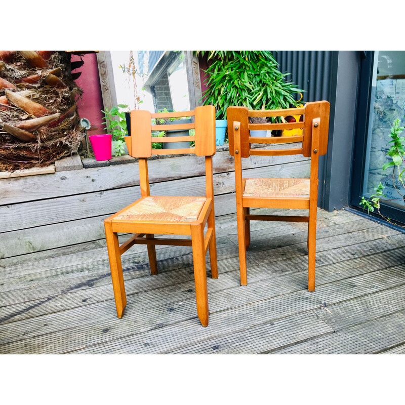 Pair of vintage wood and straw chairs by Pierre Cruège