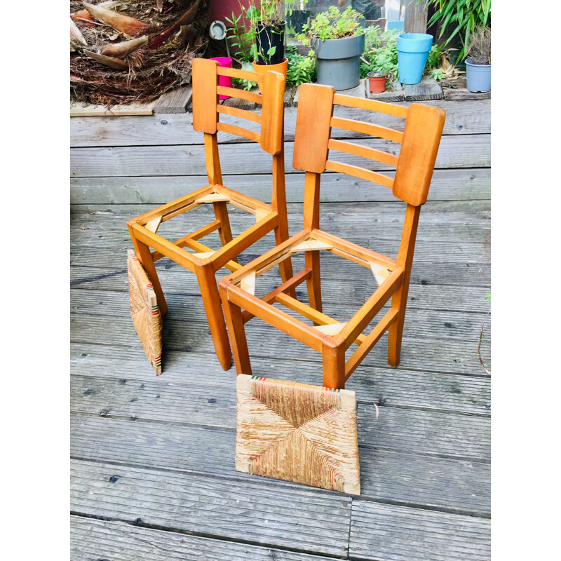 Paire de chaises vintage en bois et paille de Pierre Cruège