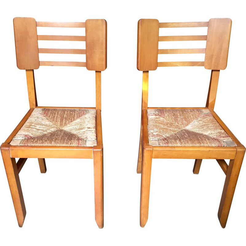 Pair of vintage wood and straw chairs by Pierre Cruège