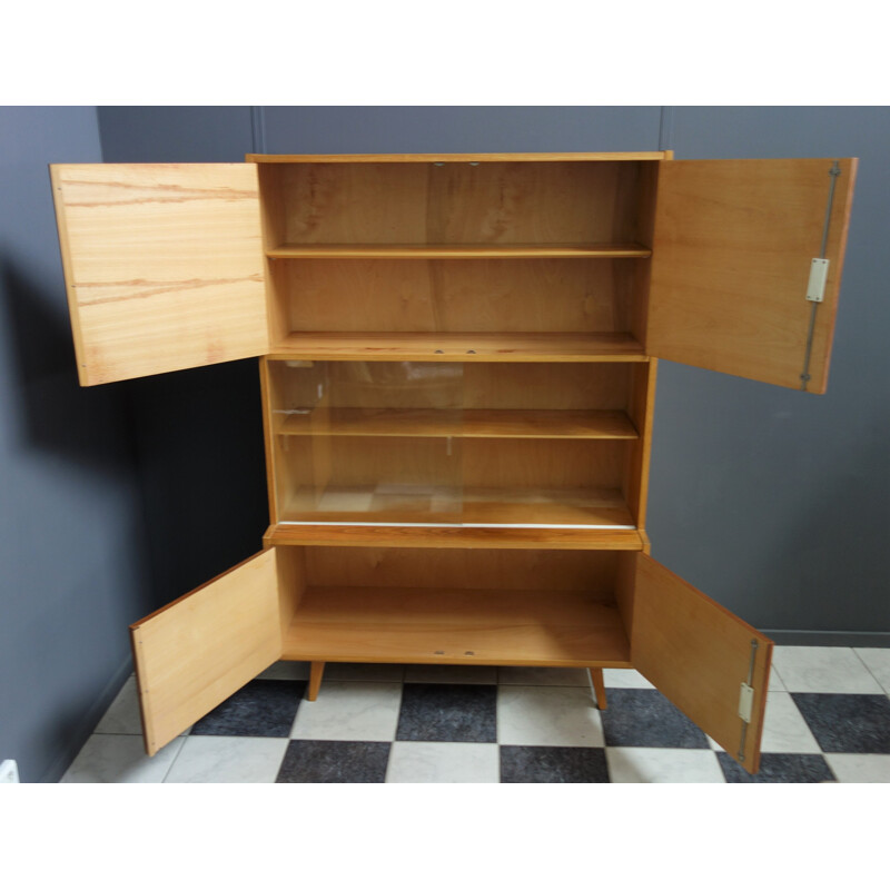 Vintage blond wood sideboard with 2 sliding glass doors by Trud Czech, 1960