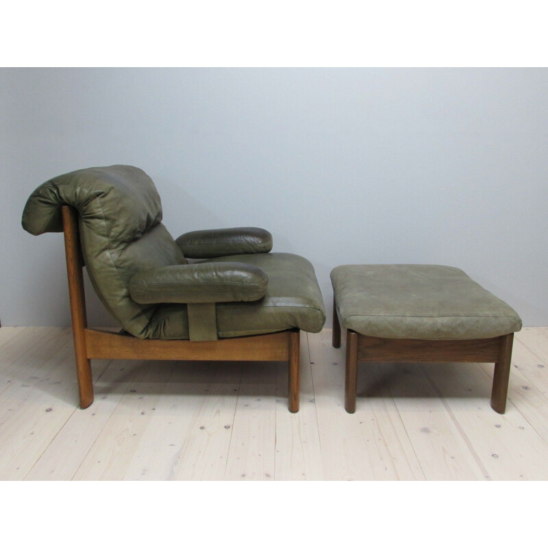 Vintage leather armchair and footrest, 1960s