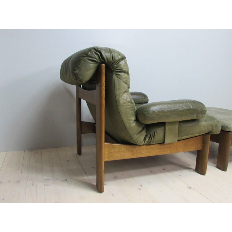 Vintage leather armchair and footrest, 1960s