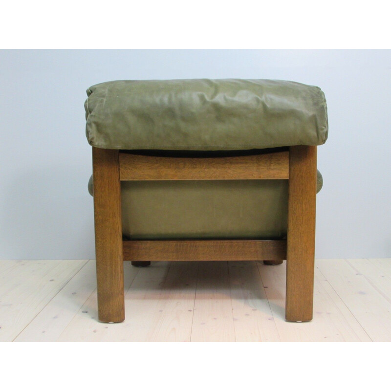 Vintage leather armchair and footrest, 1960s