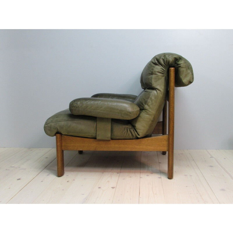 Vintage leather armchair and footrest, 1960s