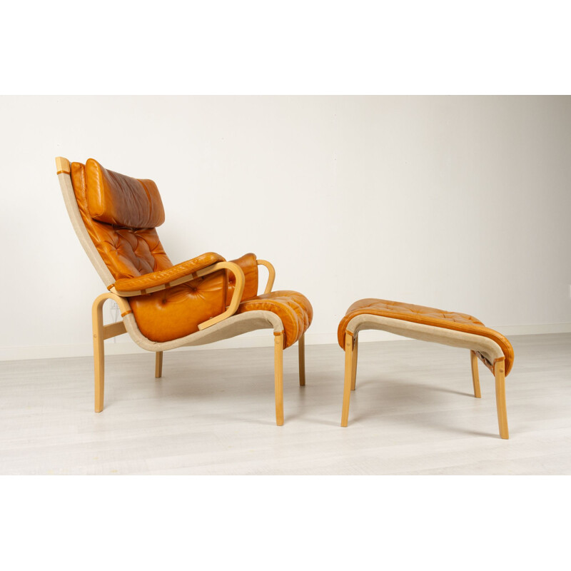 Skandinavischer Vintage Sessel und Ottoman von Nielaus