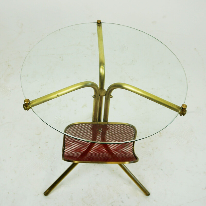 Italian mid century circular brass and glass side table with magazine rack, 1950s