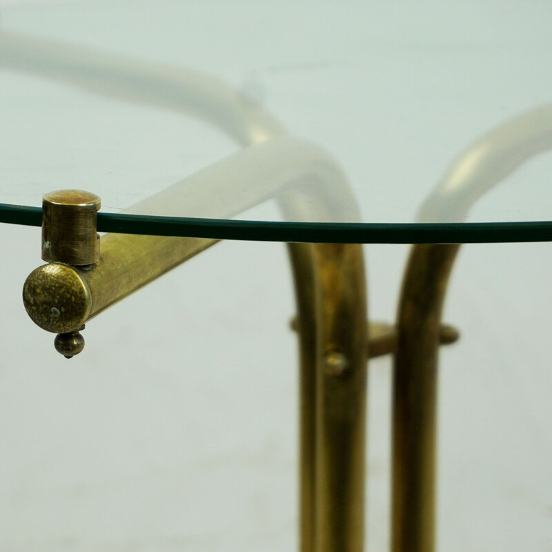 Italian mid century circular brass and glass side table with magazine rack, 1950s