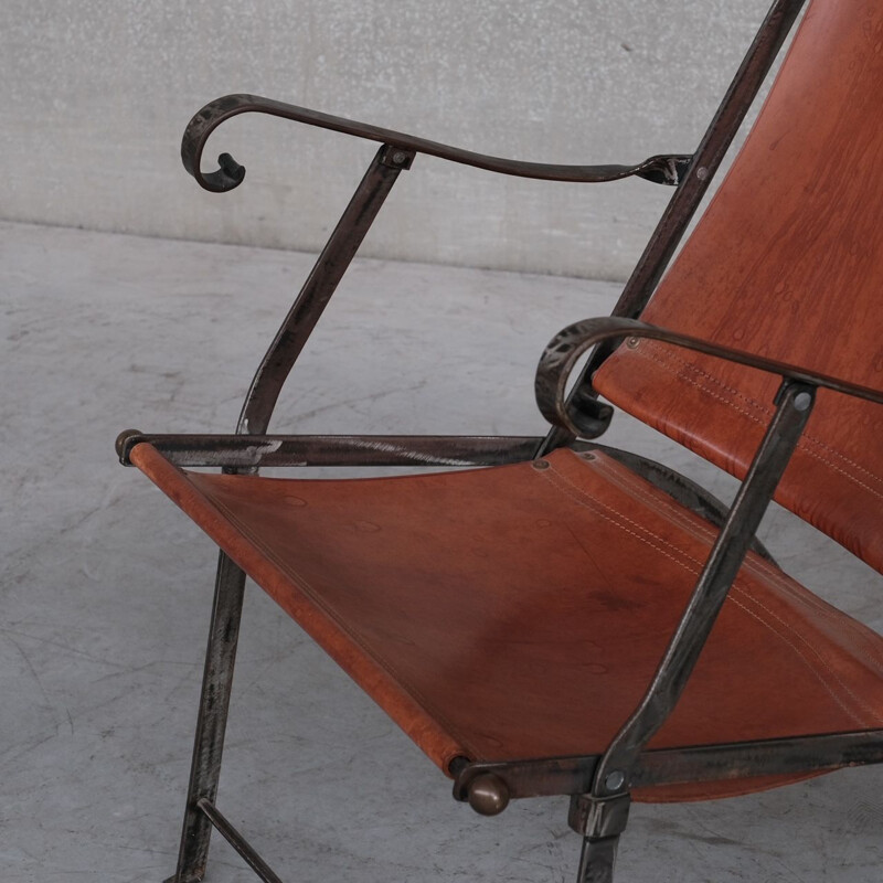 Pair of vintage folding armchairs in leather and metal, France 1950