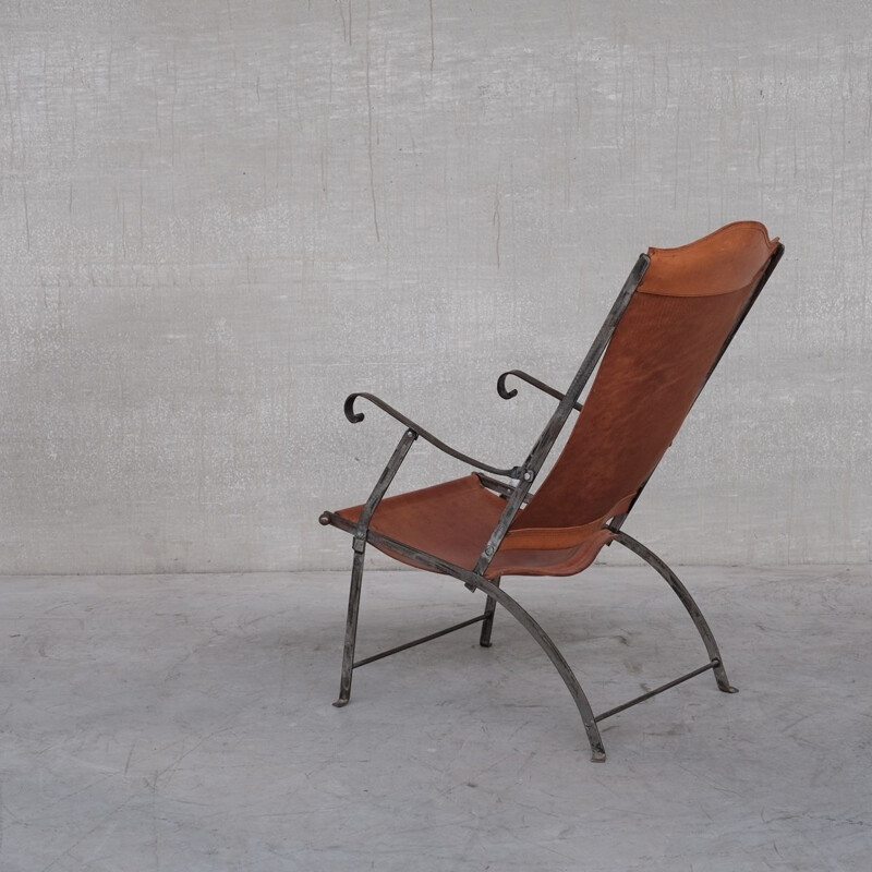 Pair of vintage folding armchairs in leather and metal, France 1950