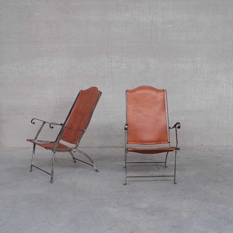 Pair of vintage folding armchairs in leather and metal, France 1950