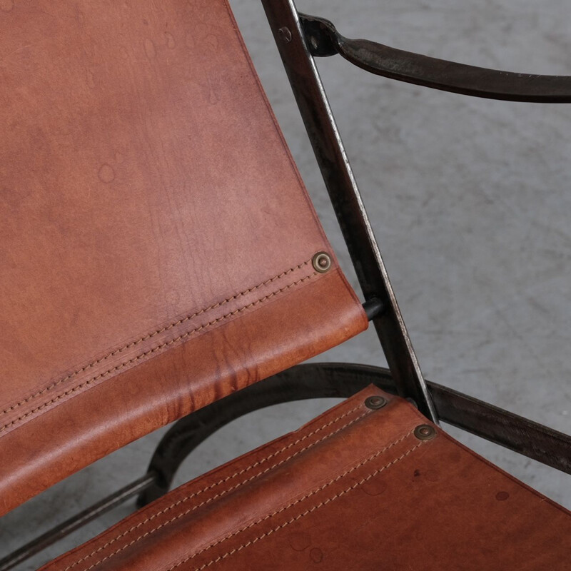 Pair of vintage folding armchairs in leather and metal, France 1950