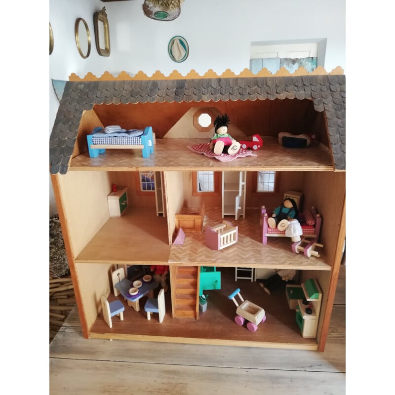 Vintage wooden dollhouse with accessories and dolls