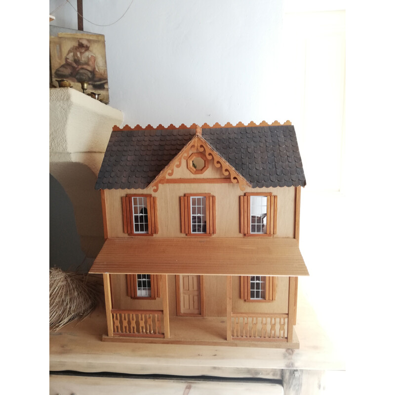 Vintage wooden dollhouse with accessories and dolls