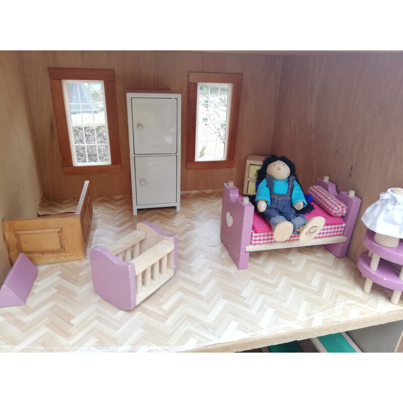Vintage wooden dollhouse with accessories and dolls