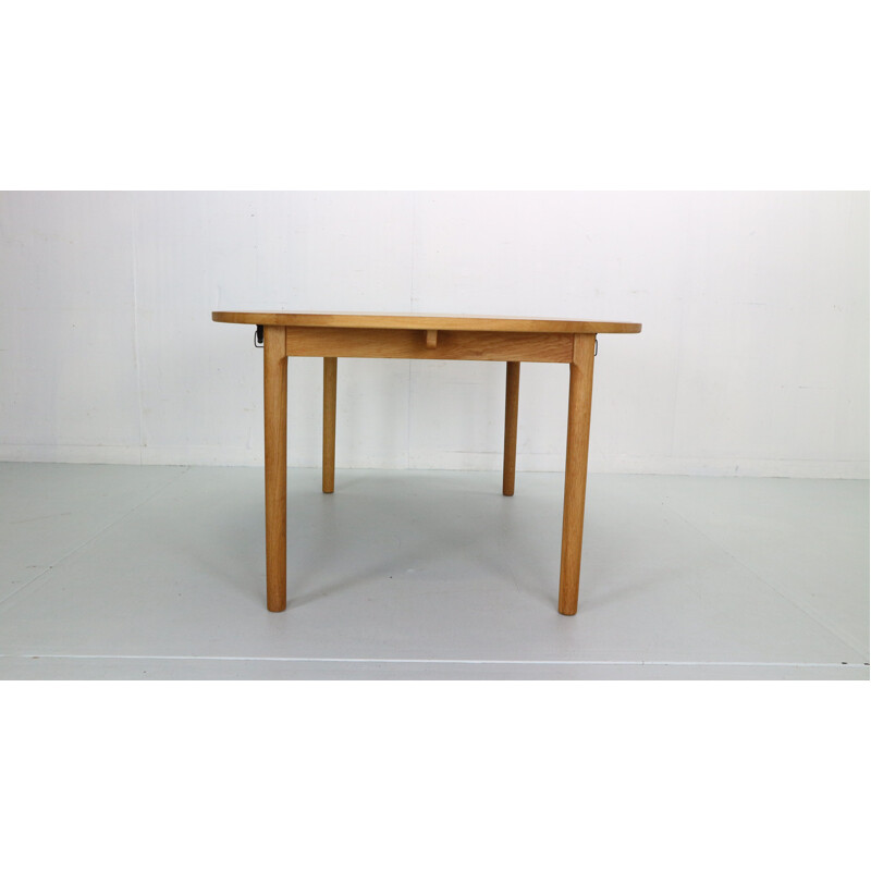 Vintage round oakwood extendable dining table by Hans J. Wegner for Ry Mobler, Denmark 1970